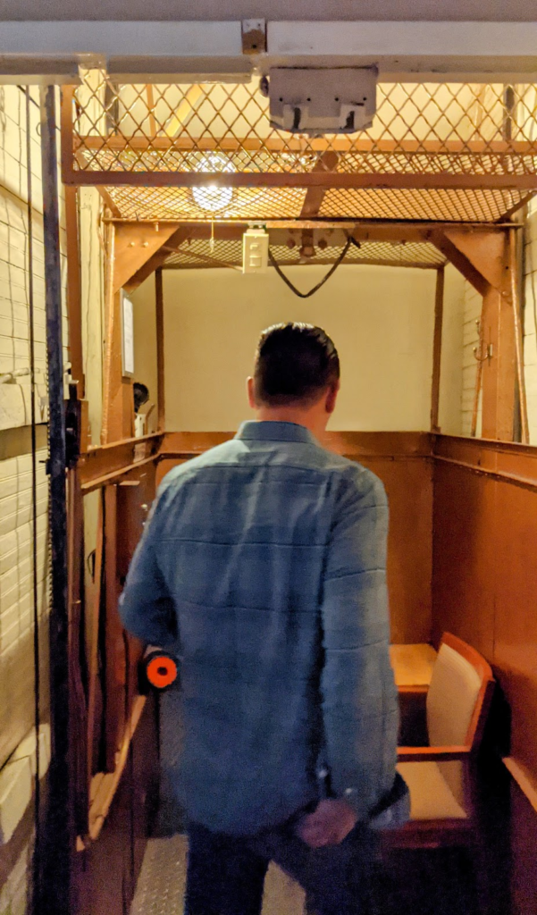 Man entering a 2-stop elevator, Brooklyn
